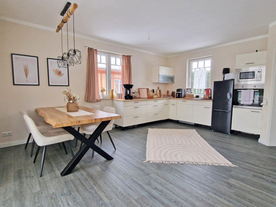 Wohnzimmer / K�che Einfamilienhaus Kr�slin